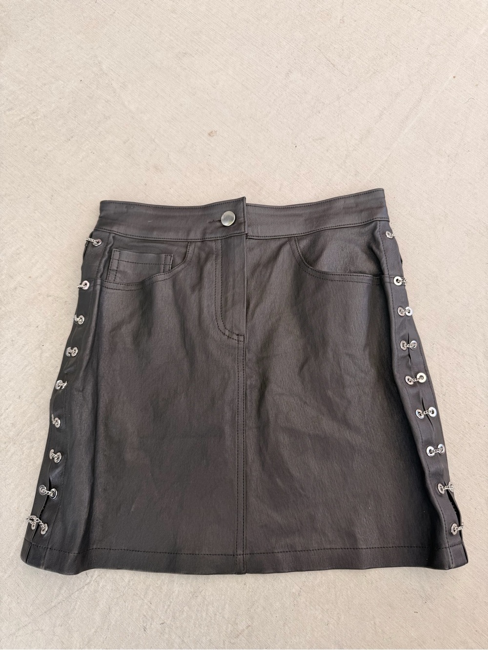 AMIRI Black Faux Leather Mini Skirt with Side Eyelet Detail